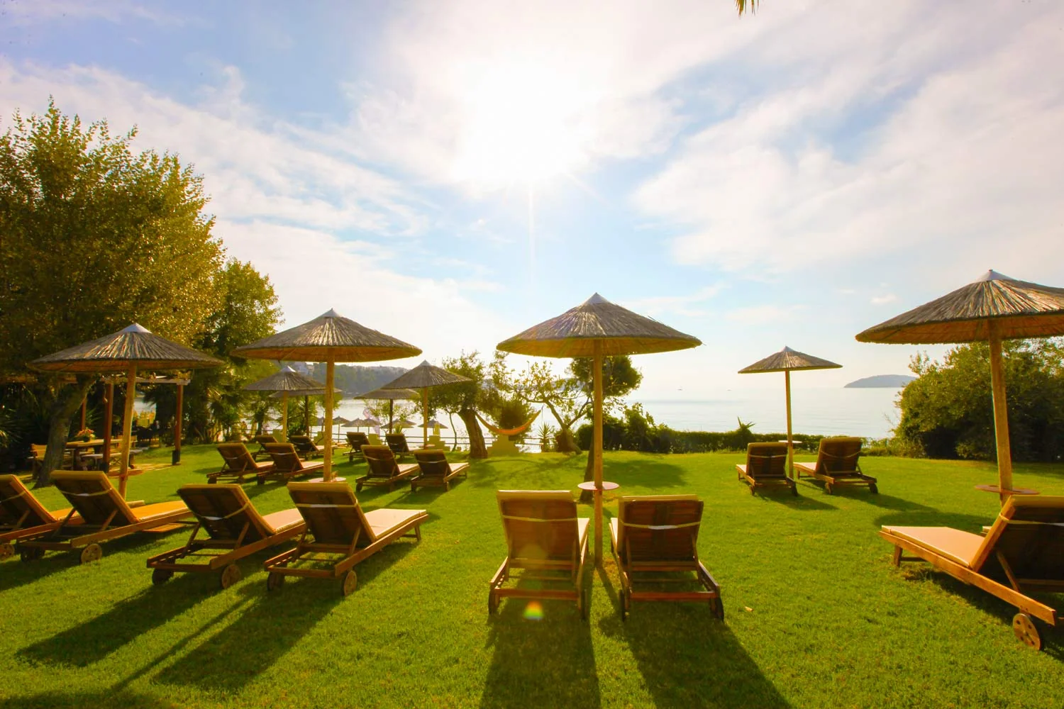 The hotel garden opens towards the sea